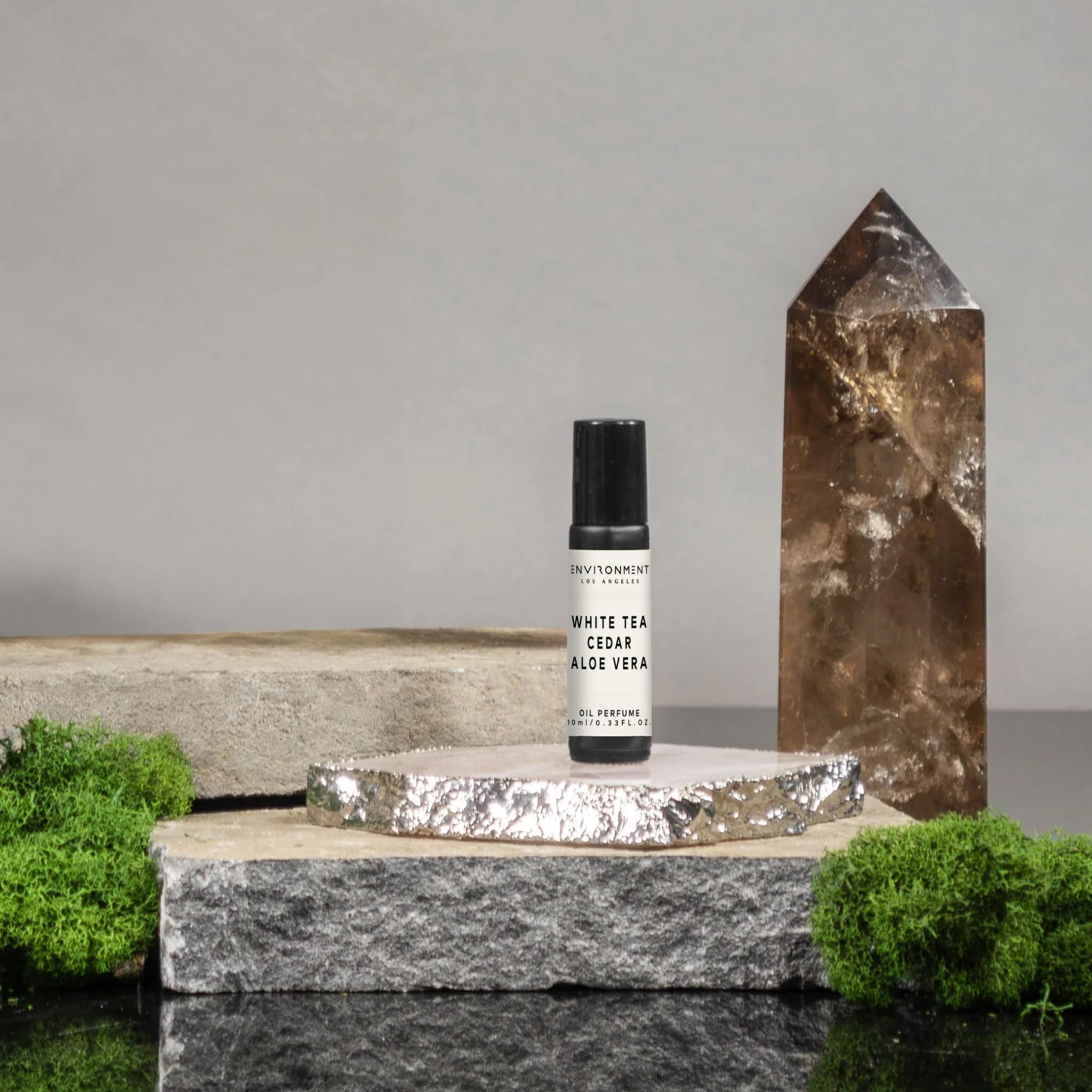 ENVIRONMENT WSTN roll-on application close-up for precise, subtle scent touch-ups.