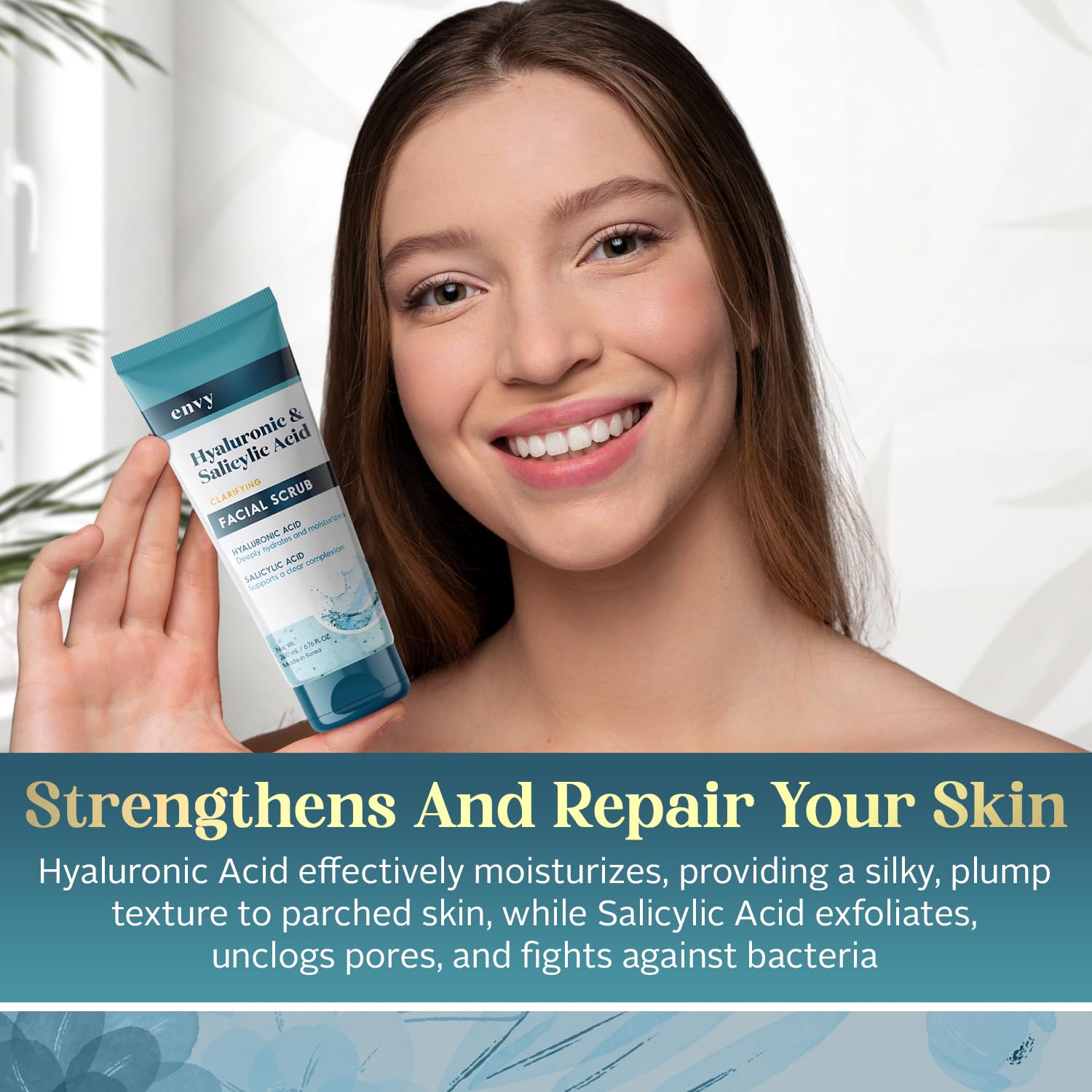 Hand applying Envy scrub to demonstrate gentle exfoliation and even coverage.