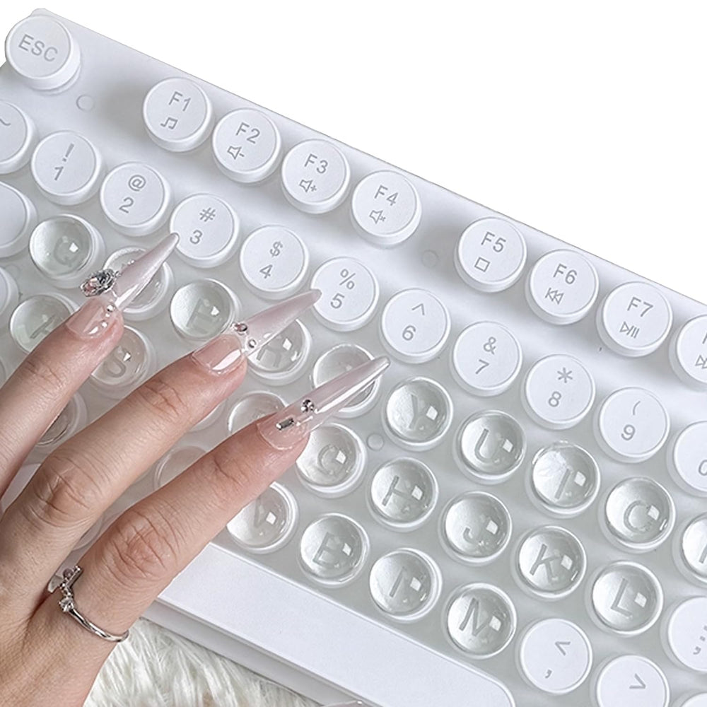 ERRECI keyboard stickers for long nails on a clear glass surface showing enhanced key visibility