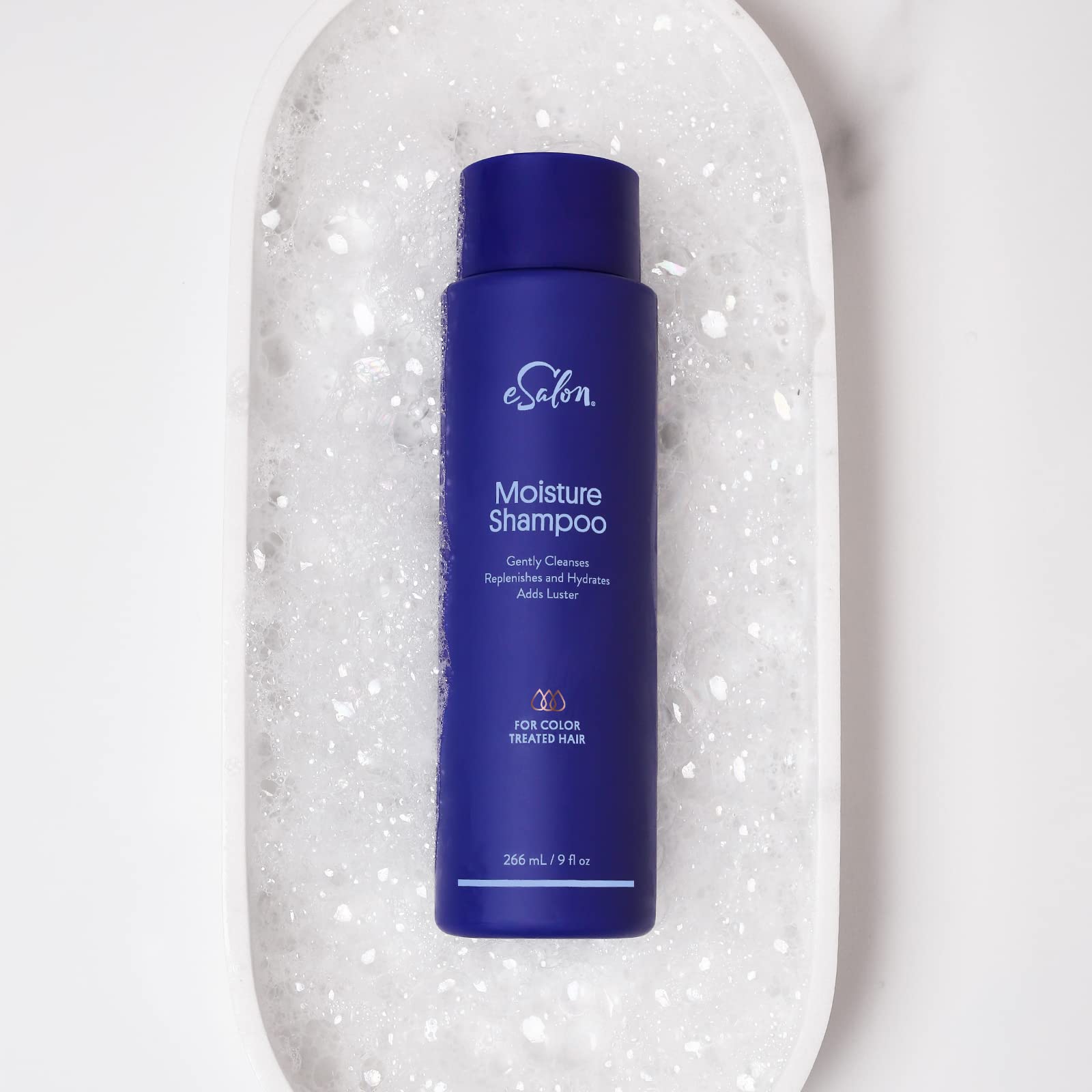 Esalon Sulfate-free shampoo bottle close-up signals gentle cleansing.