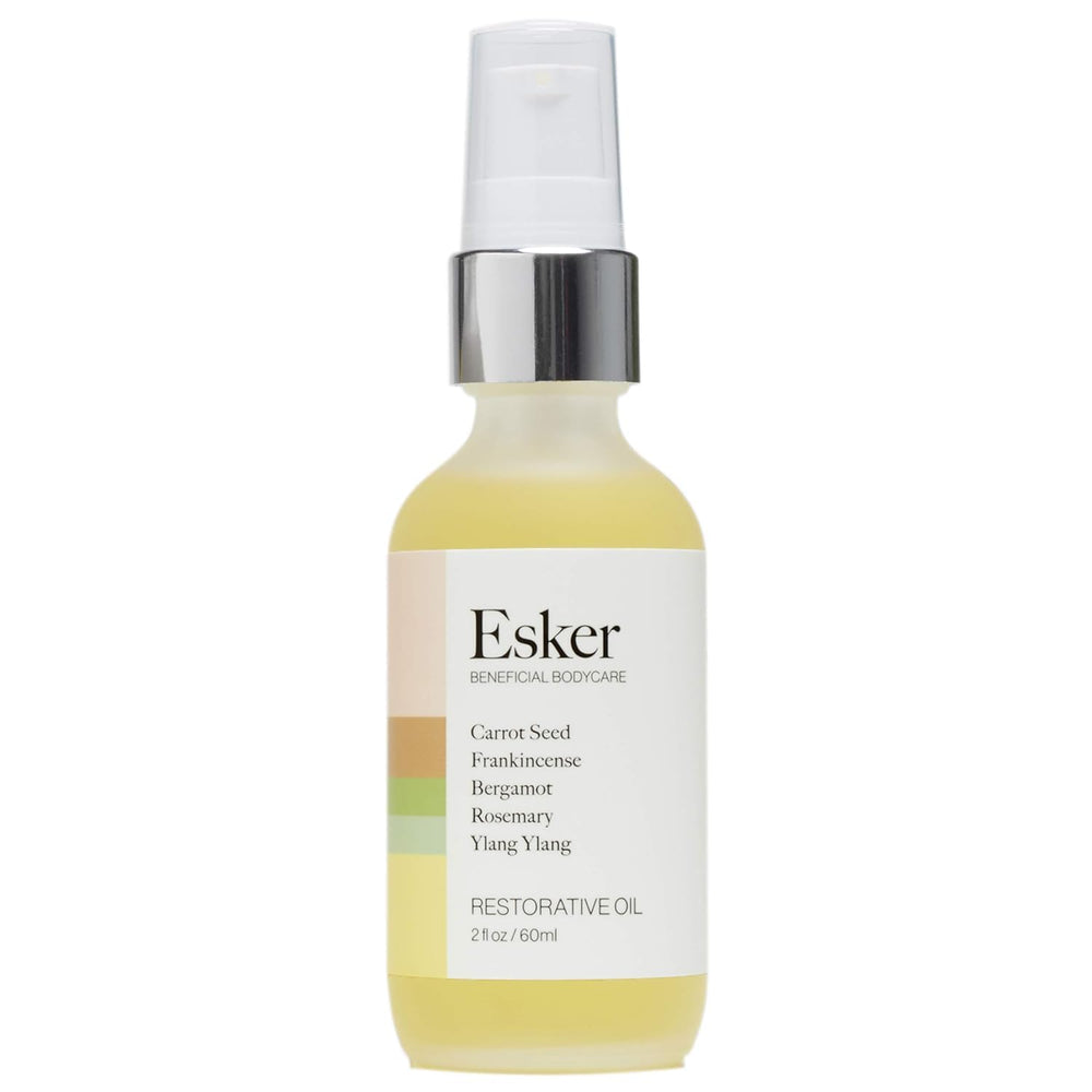 ESKER Restorative Body Oil bottle pour for easy application and hydration.