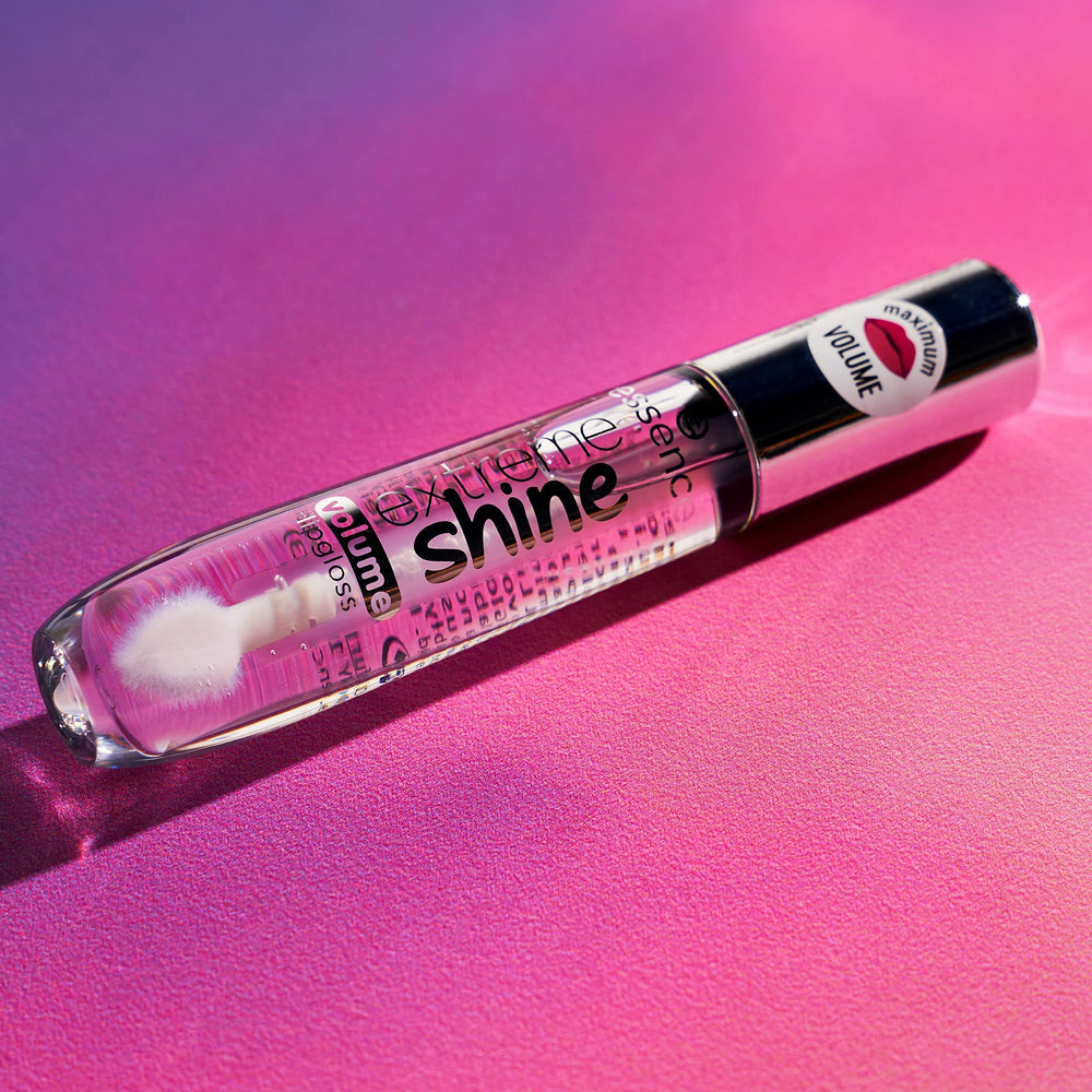 Essence crystal clear lip gloss on lips in close-up with bright shine.