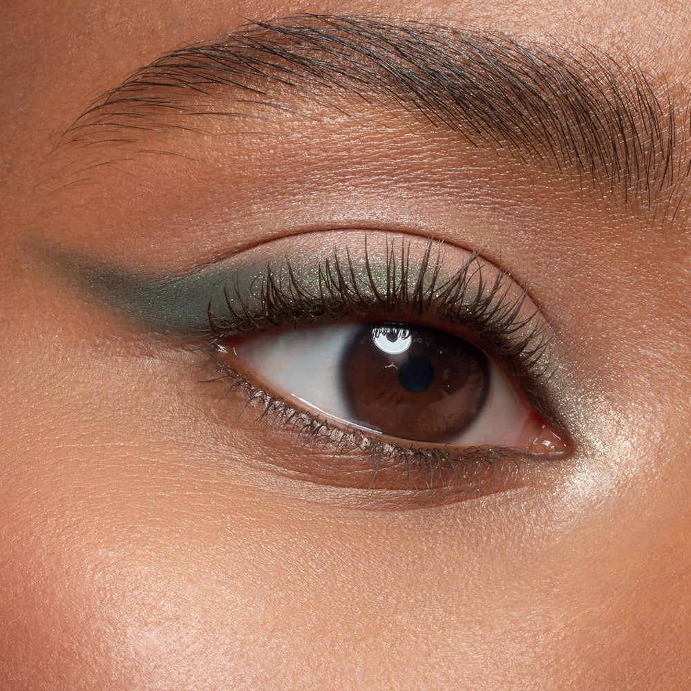essence Lash Princess Brown mascara delivering subtle intensity to brighten eyes.
