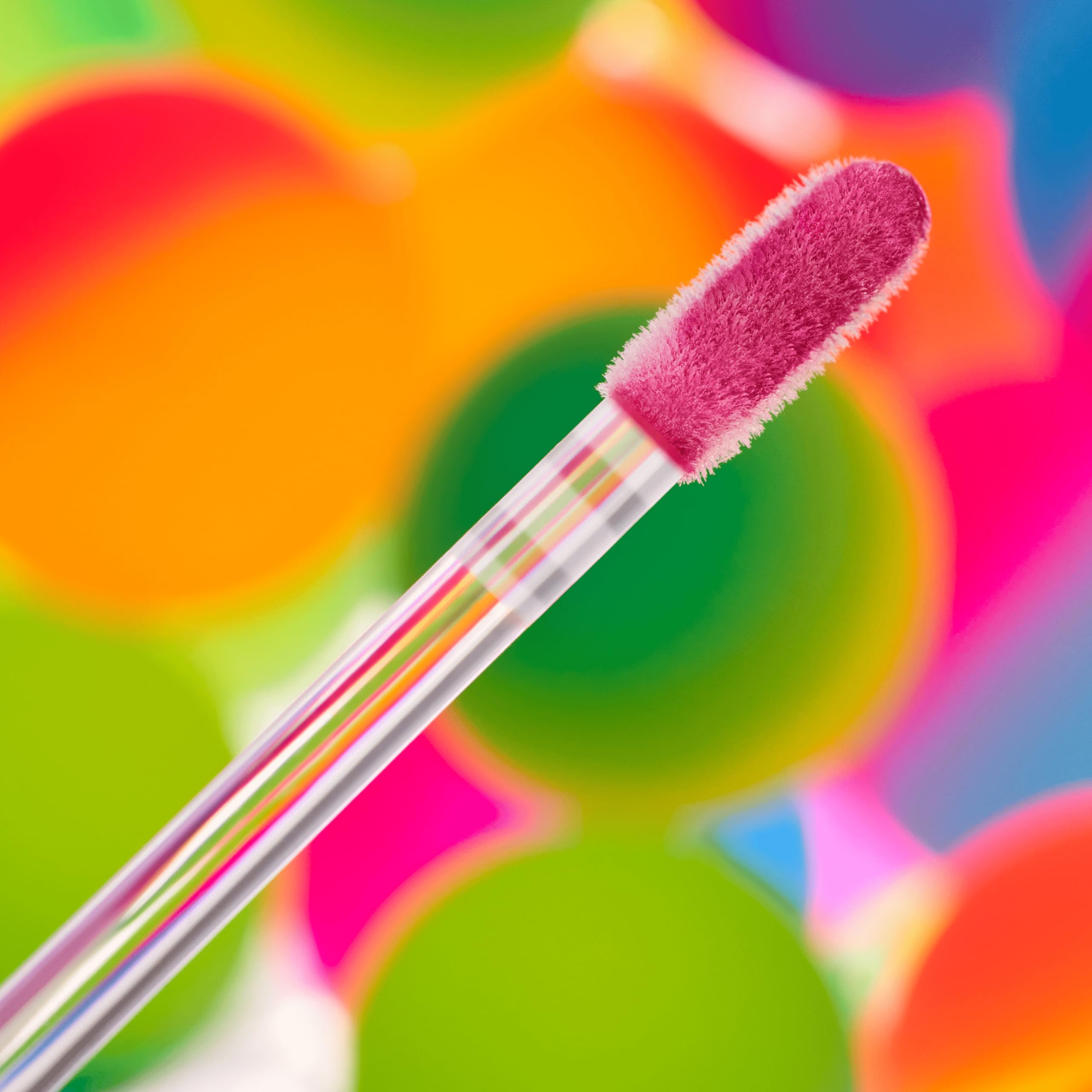 essence Meta Glow pink vision iridescent shade on lips for festival ready glow.