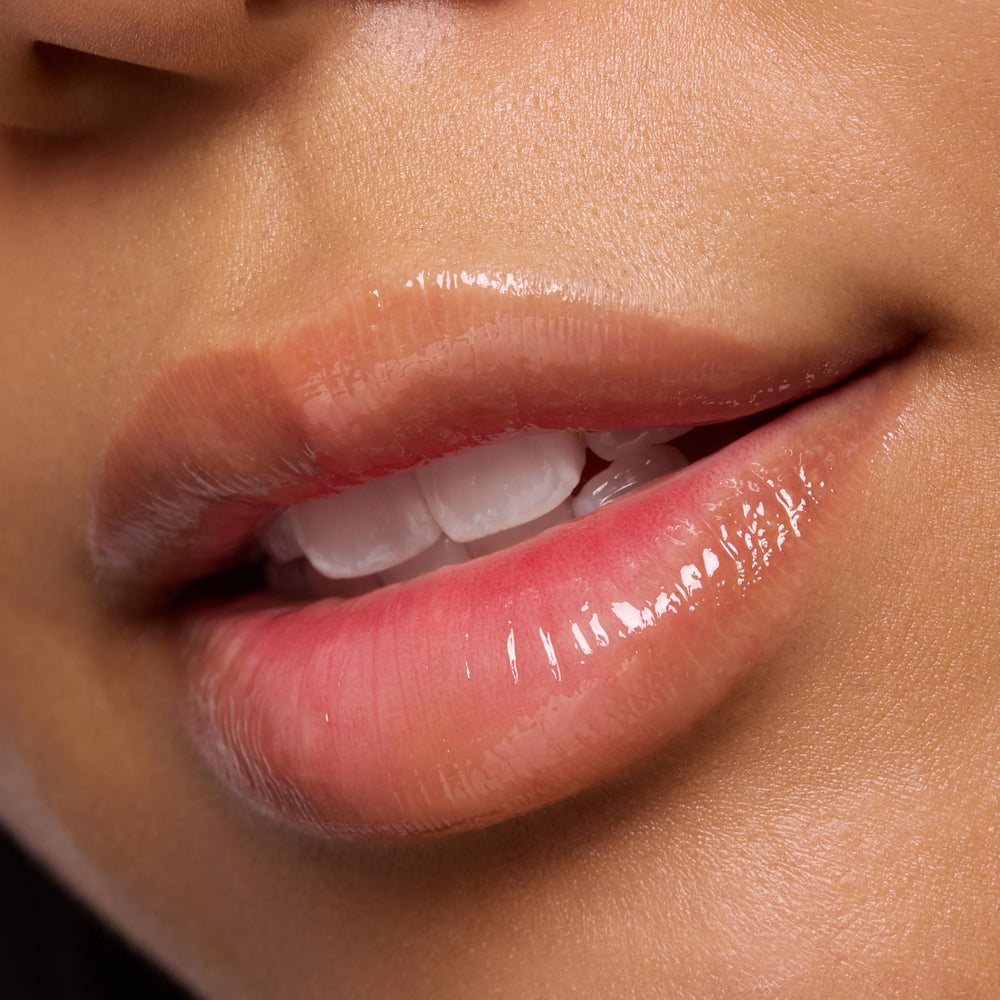 essence Super Peptide Glossy Lip Treatment swatch with shea butter.