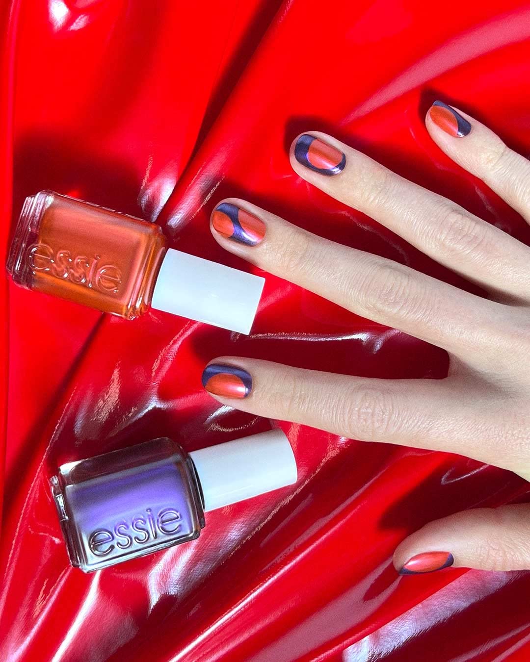 Essie Flirt With Freedom blackened purple shade catching light with shimmer
