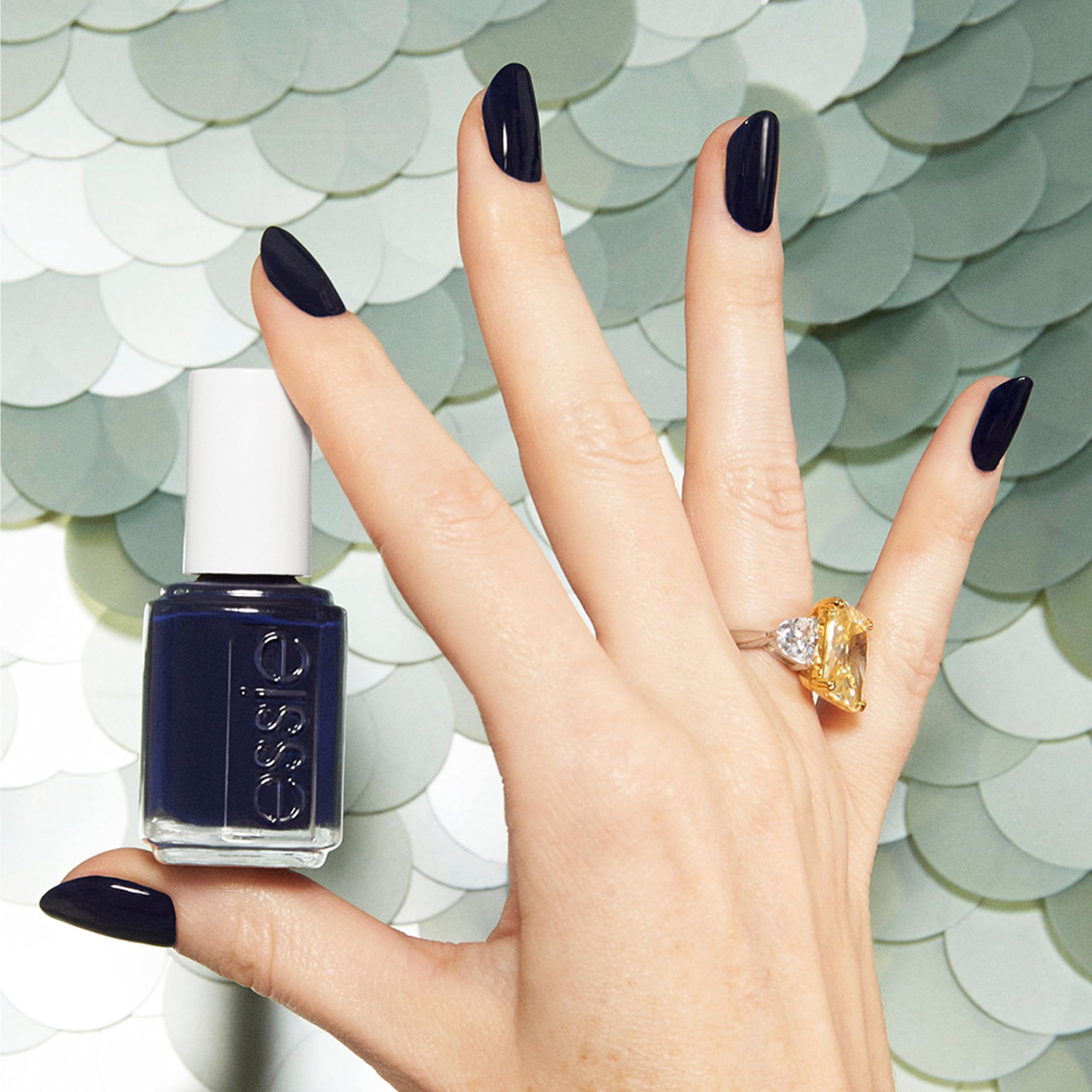 Essie Step Out of Line close-up showing a creamy jewel-toned indigo finish.