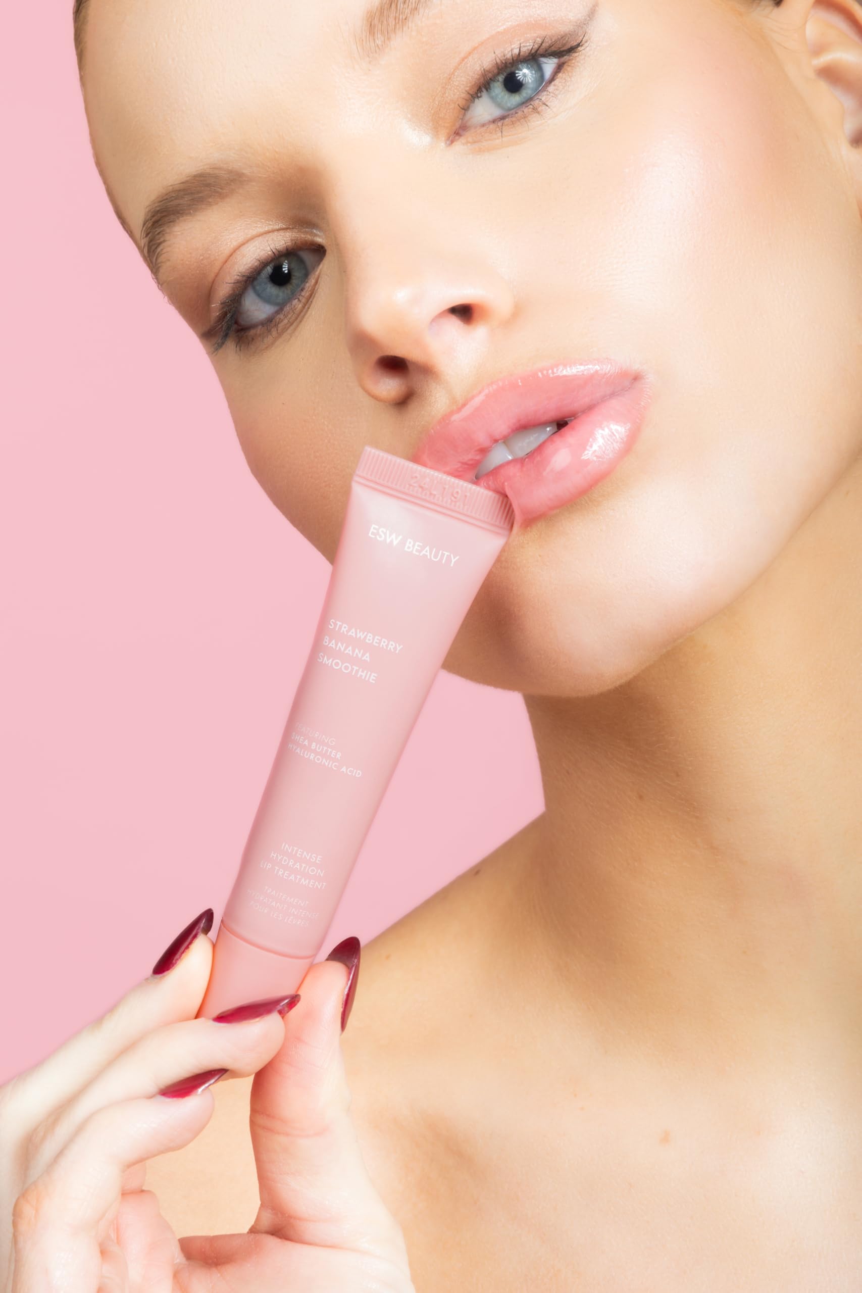 ESW Beauty Strawberry Banana Smoothie Lip Treatment premium gloss-like finish on lips.