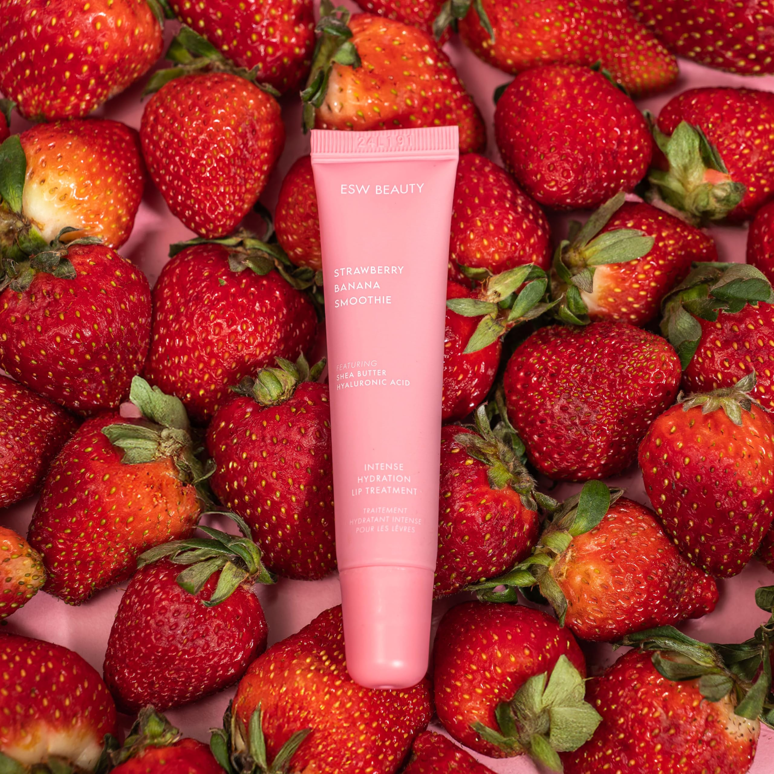 ESW Beauty Strawberry Banana Smoothie Lip Treatment swatch on lips for a soft tint.