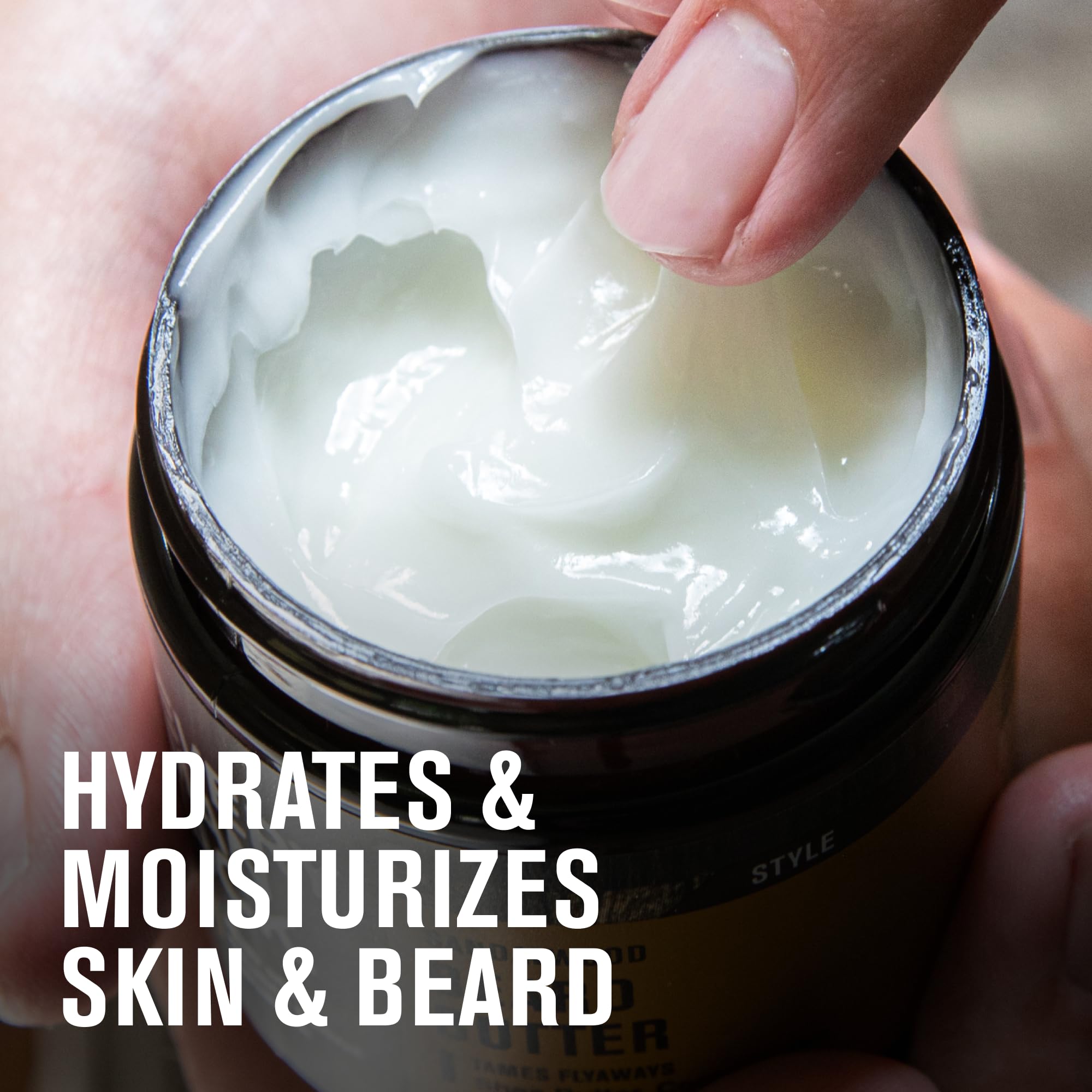 Hands applying Every Man Jack Beard Butter Vanilla Cedar to beard