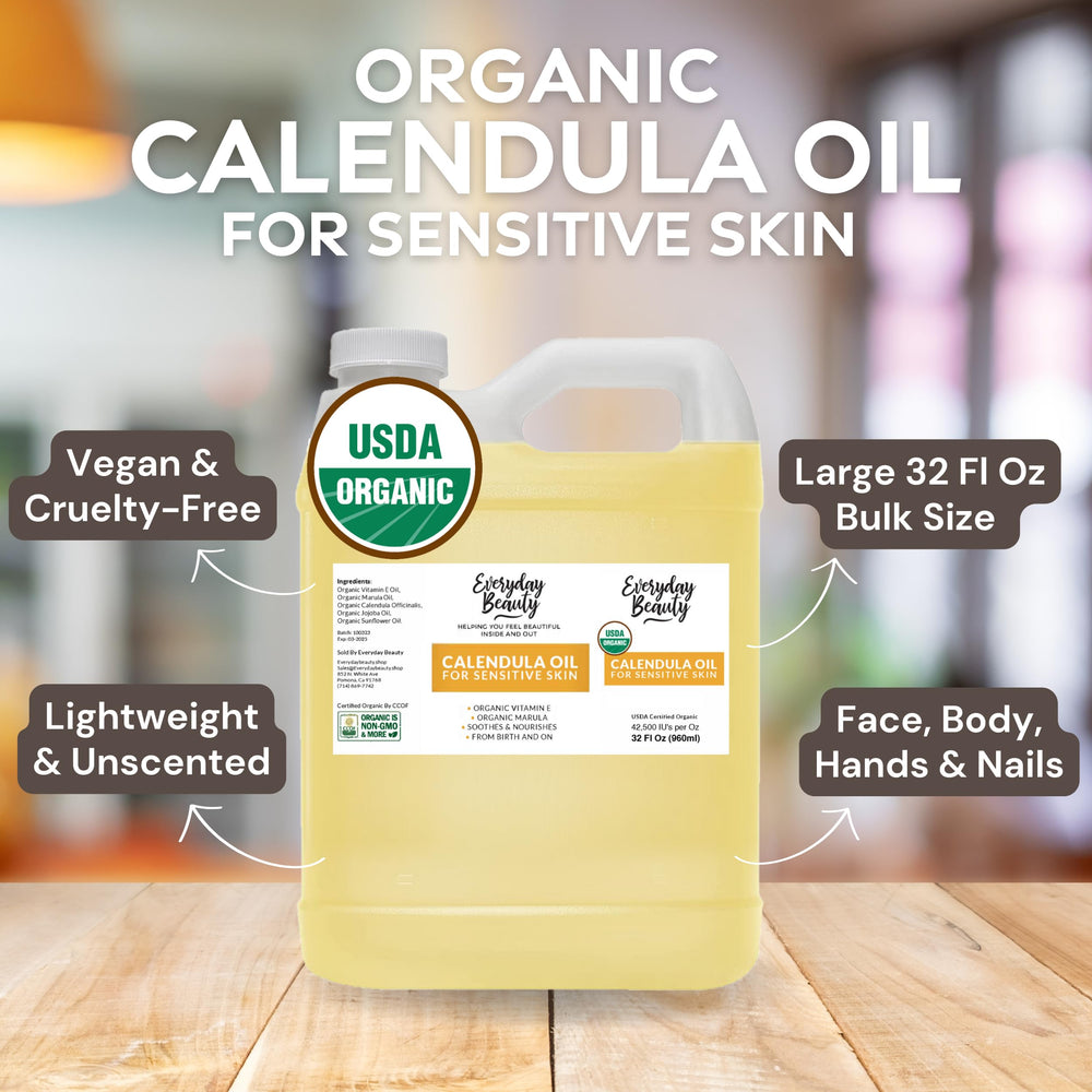everyday beauty organic jojoba oil and calendula blend on light surface.