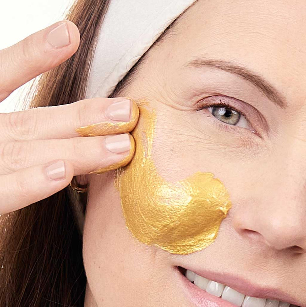 Evolve Organic Beauty golden shimmer mask swirl shows luxurious texture for glowing skin.