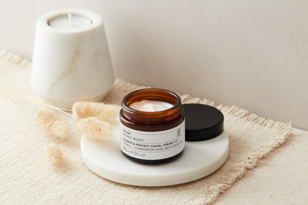 Applying Evolve Hydrate and Protect cream for quick absorption and smooth skin.