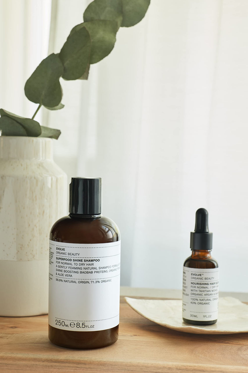 Close-up of Evolve Superfood Shine conditioner texture delivering hydration and softness.