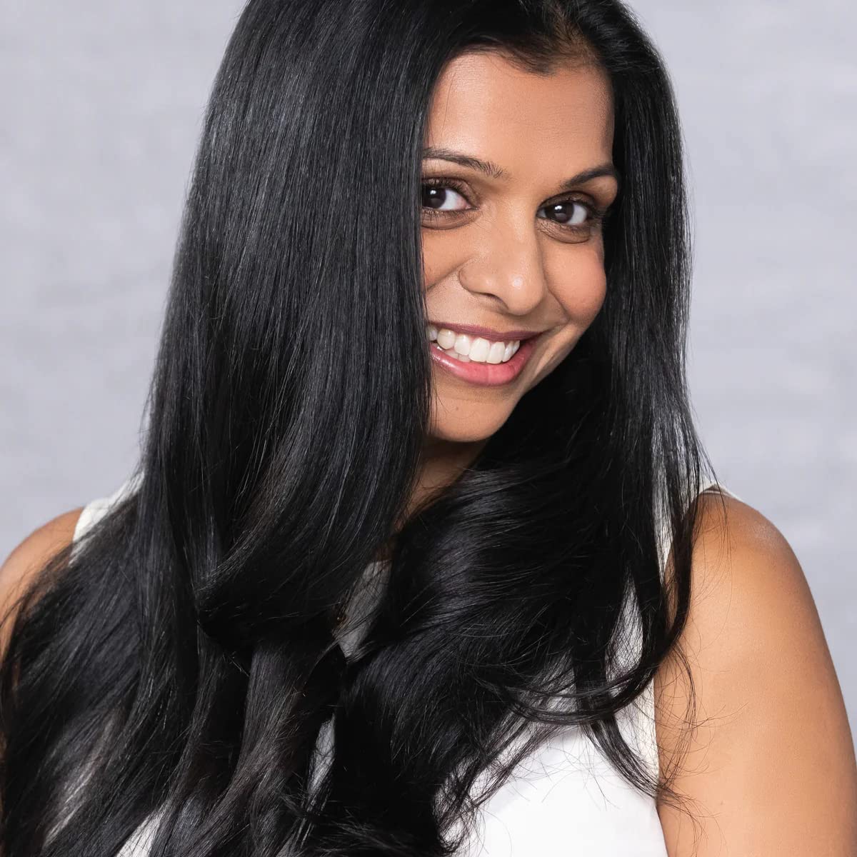 Eco-friendly packaging of EVOLVh UltraShine Moisture Conditioner supports vegan beauty choices.