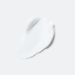 Pouring EVOLVh UltraShine Moisture Conditioner showing easy detangling application