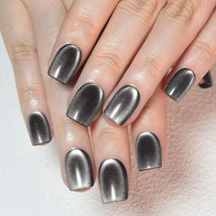evpct cat eye nails on hand with black-silver shimmer for instant glam.