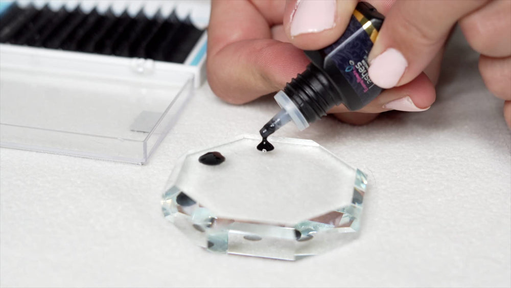 Glue bottle with precision needle for controlled dispensing.