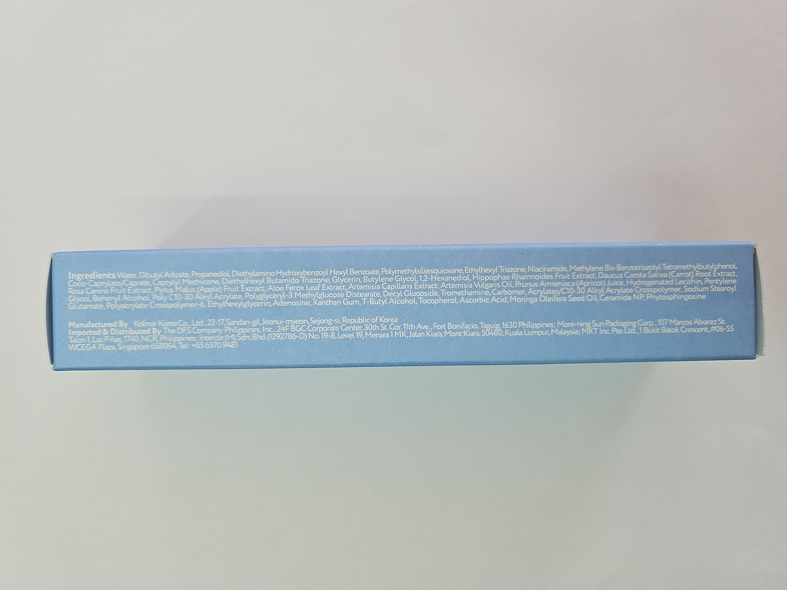 Water resistance icon and label on Purity Sun Essence bottle