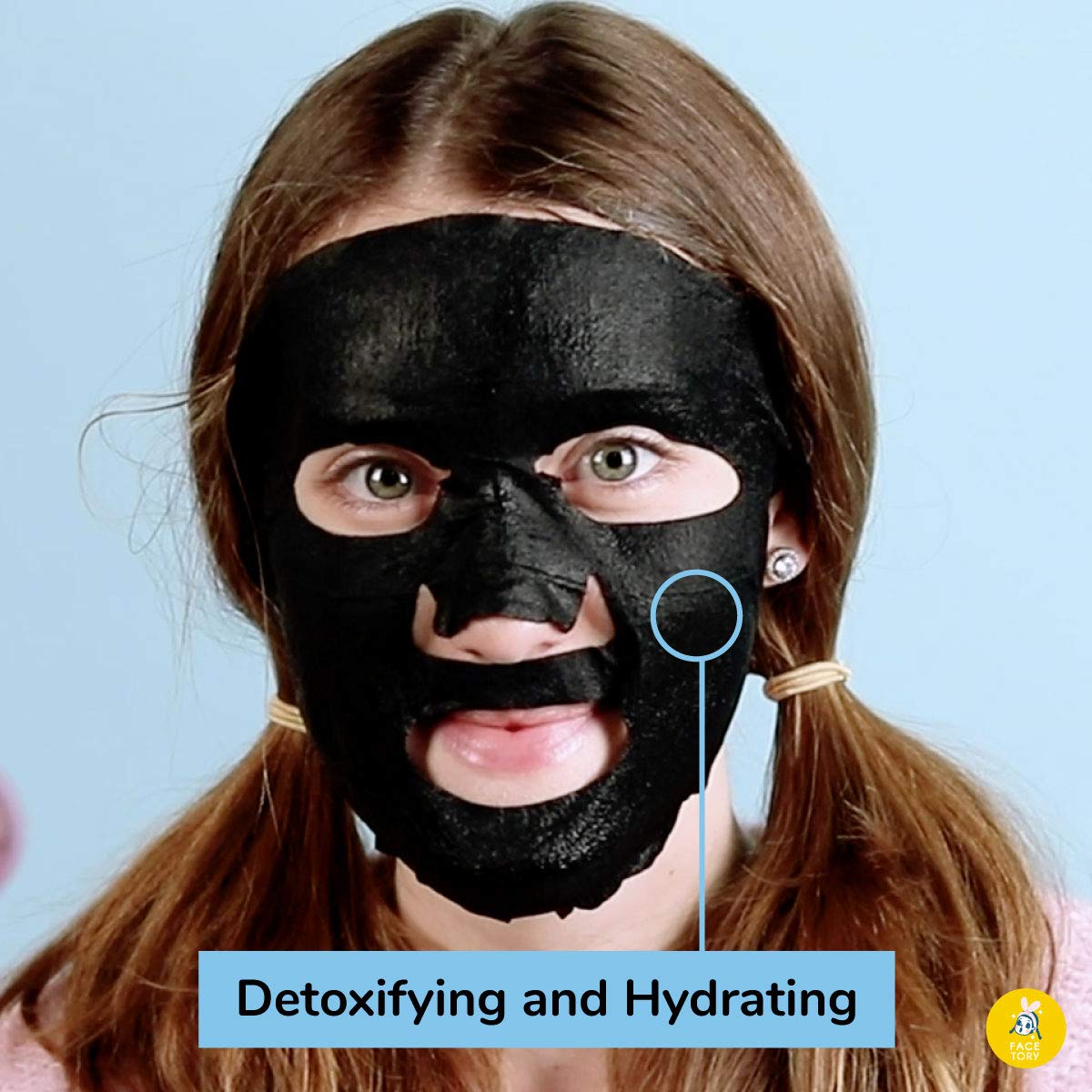 FACETORY Let's Talk Detox charcoal-material sheet mask on skin for gentle exfoliation.
