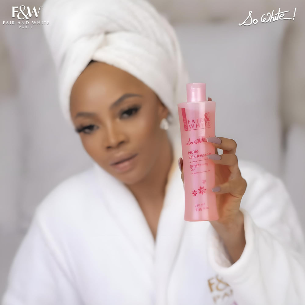 FAIR & WHITE So White Body Oil drops on hand for nourishing care.