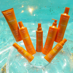 Applying Fanola Nourishing Wonder to mid-lengths and ends for detangling.