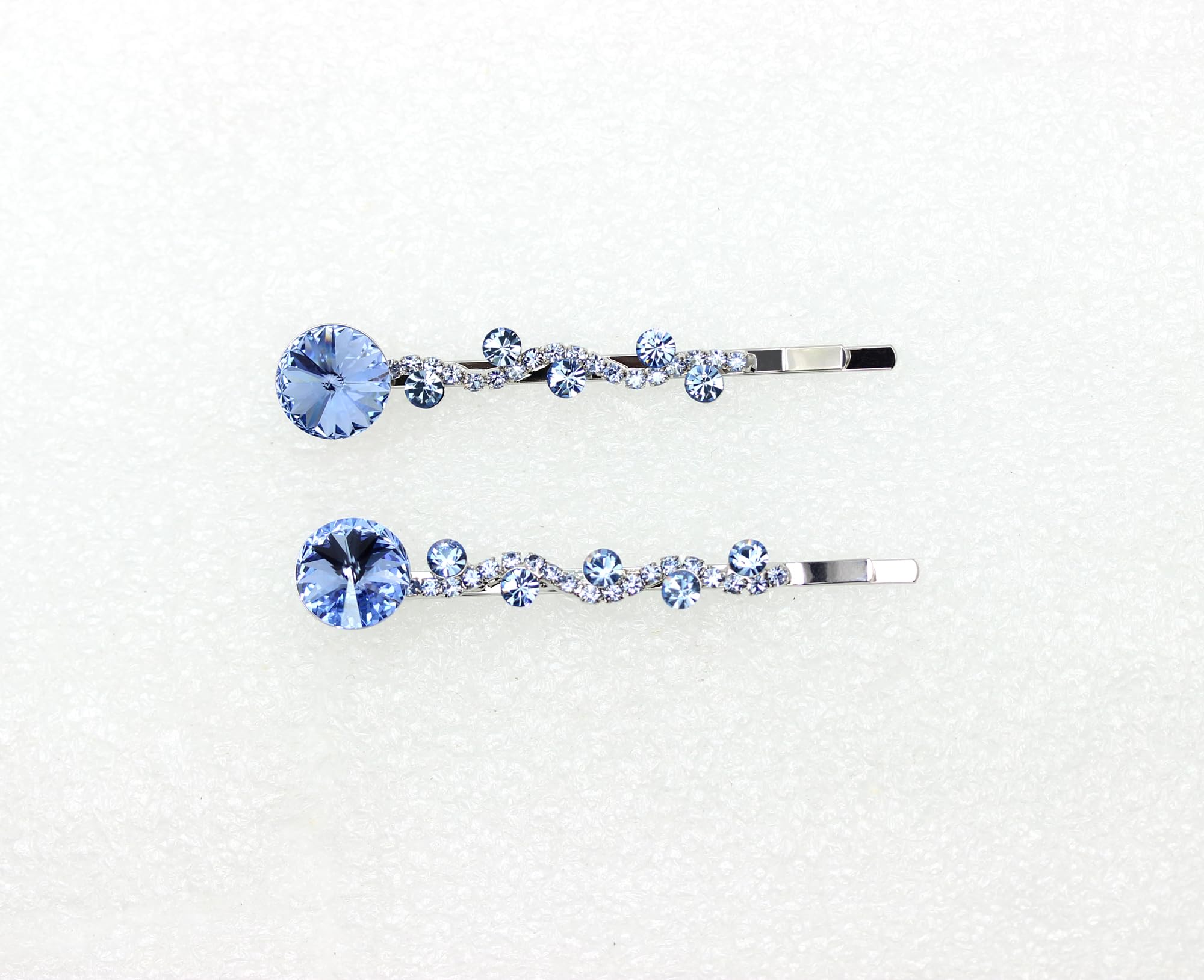 Elegant Faship accessory with light blue crystals enhances bridesmaids' hairstyles