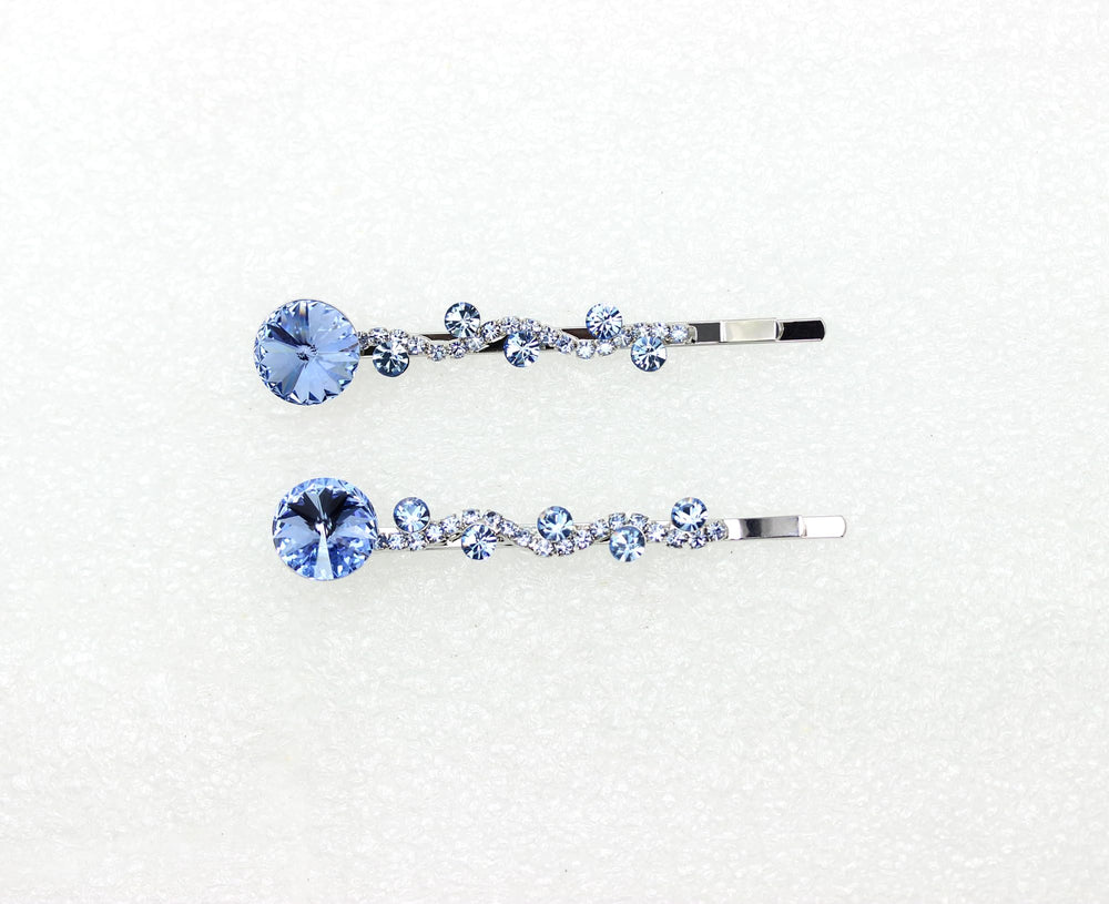 Elegant Faship accessory with light blue crystals enhances bridesmaids' hairstyles