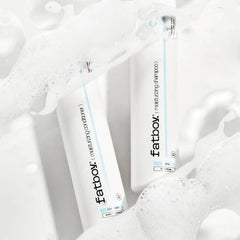 Fatboy Moisturizing Shampoo being massaged into hair for gentle cleansing.