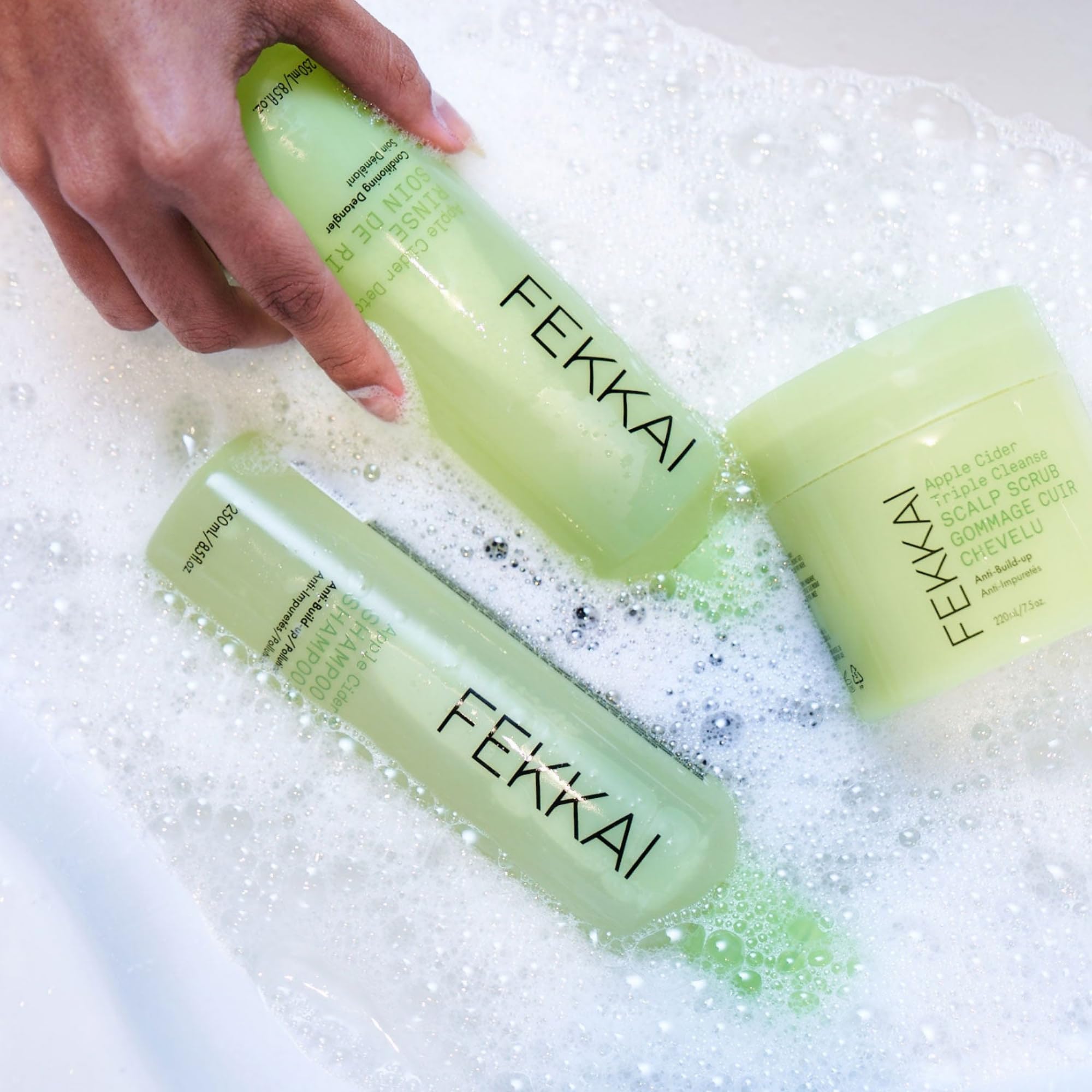 FEKKAI Apple Cider Detox rinse bottle delivering detangled, shiny hair.
