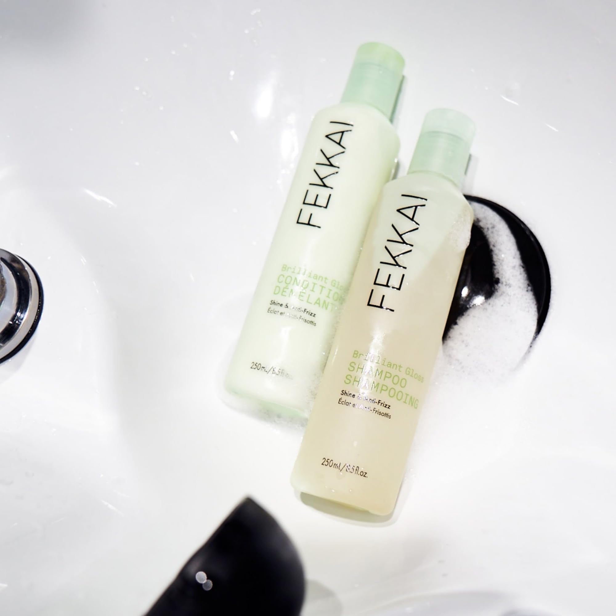Applying Fekkai conditioner to damp hair for slip and smoothness.