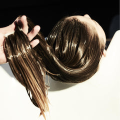 Fekkai Brilliant Gloss Multi-Tasker cream texture highlights moisture and frizz reduction.