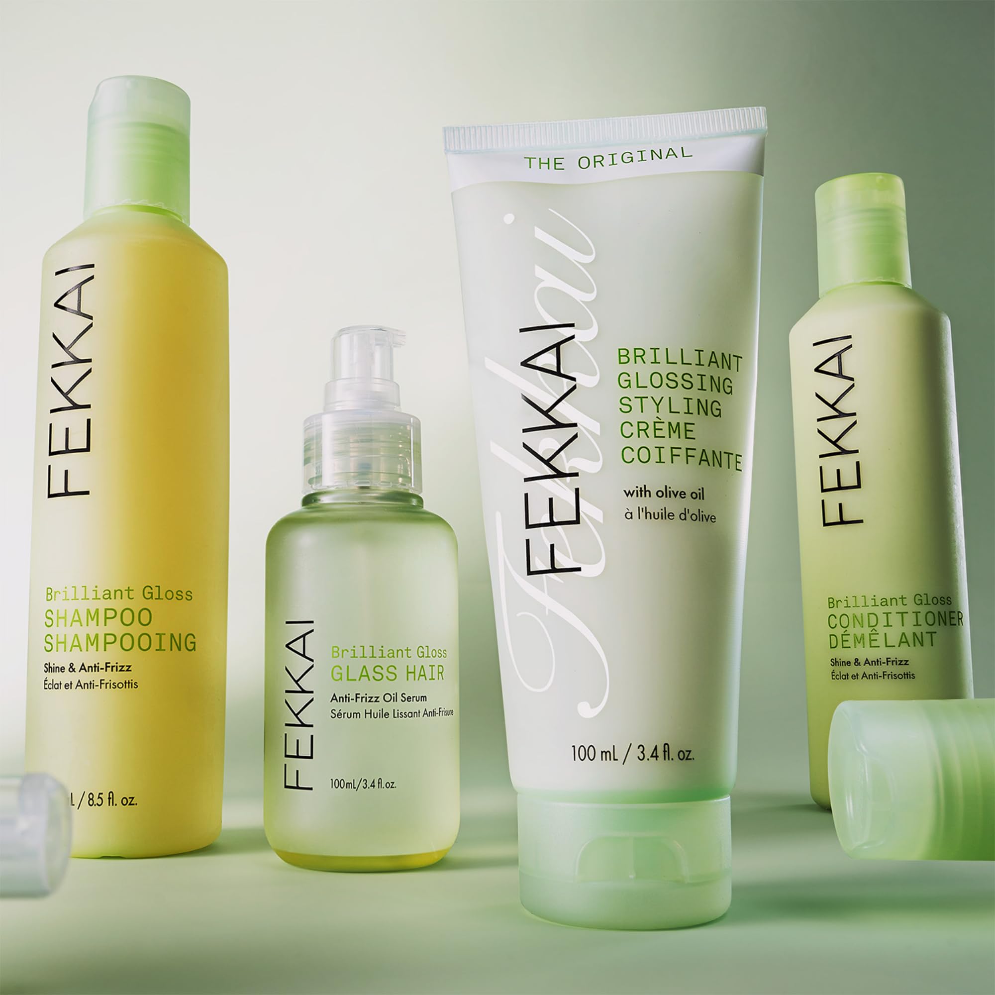 Fekkai Olive Oil shine boost image emphasizes glossy, frizz-free results.