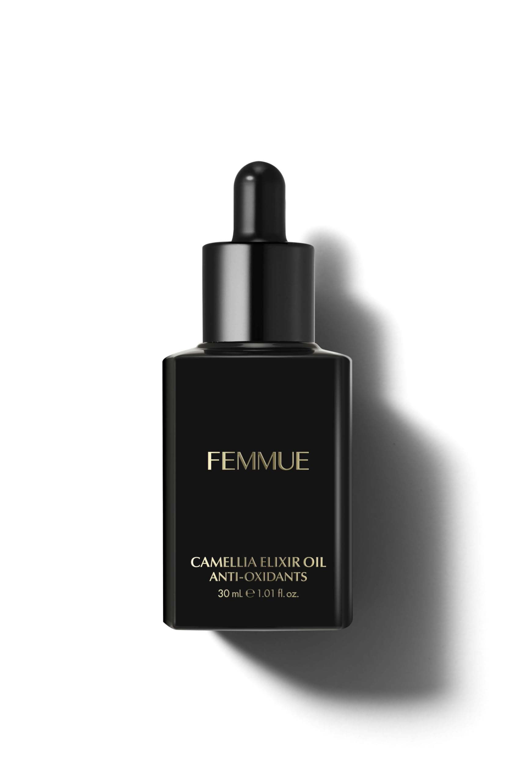 FEMMUE Camellia Elixir bottle pours for a hydrating skincare moment.