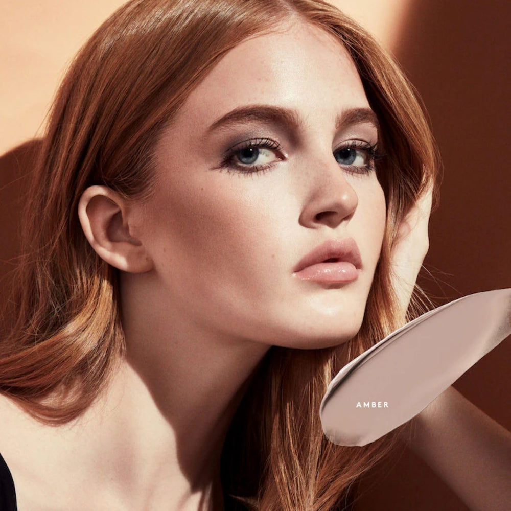 Fenty Beauty Cheeks Out Freestyle Cream Bronzer 01 Amber application shot for buildable contour.