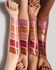Fenty Beauty Gloss Bomb Color Drip Lip Cream glaze on lips with moisturizing shine.