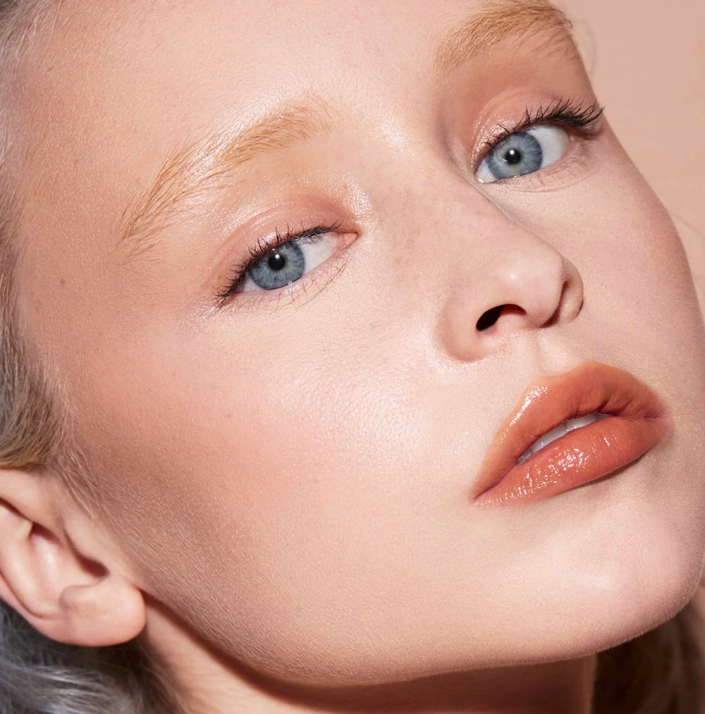 FENTY BEAUTY Gloss Bomb Cream Color Drip Honey Waffles close-up highlights moisture.