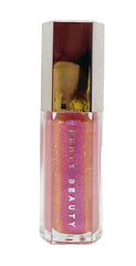 Fenty Beauty Gloss Bomb Grape Splash provides universal shine on lips.