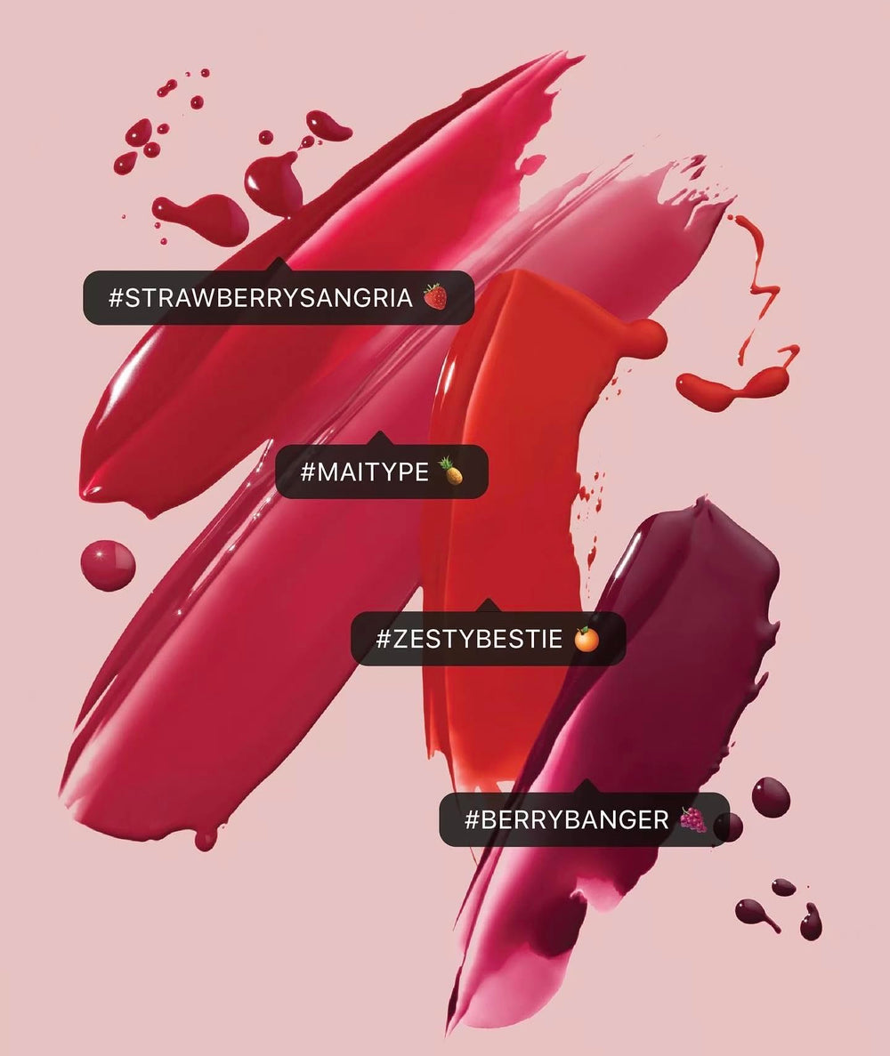 Fenty Beauty Poutsicle Zesty Bestie bottle close-up emphasizes sleek packaging and coral color