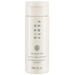 FENTY BEAUTY The Rich One Moisture Repair Shampoo mini bottle promotes softness and shine