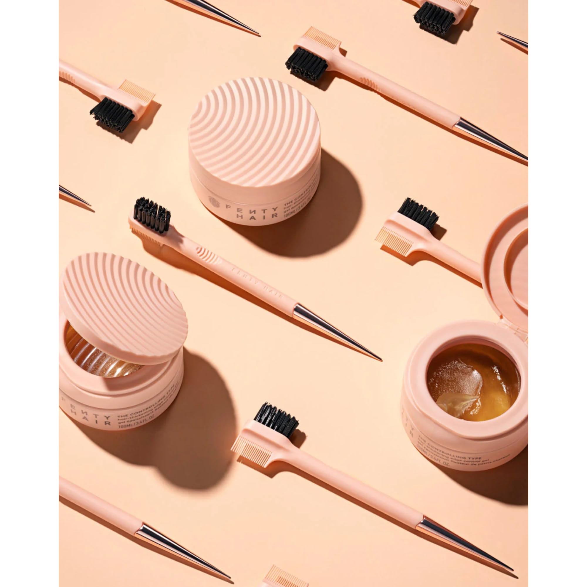 Fenty Hair edge-control gel delivers controlled, glossy finish for styles.