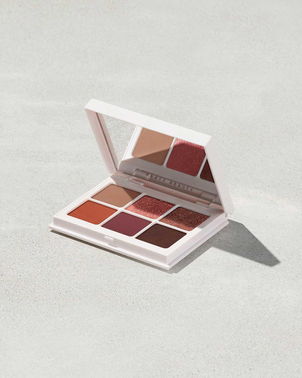 Fenty Beauty Snap Shadows True Neutrals open palette showing six shades for versatile looks.