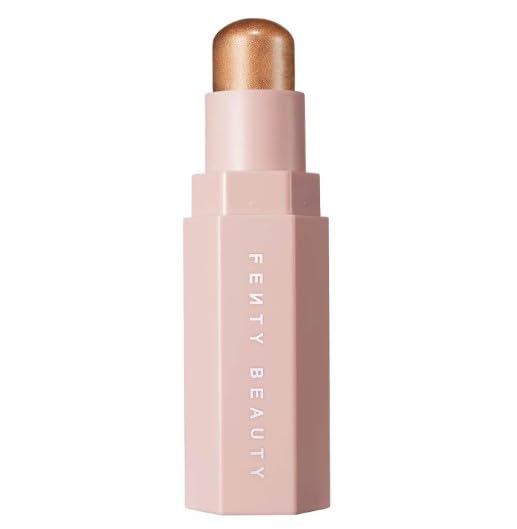 Fenty Crownd Shimmer Skinstick application creates soft, luminous cheekbone highlight.