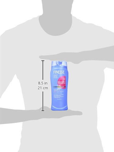 FINESSE 2-in-1 moisturizing shampoo lather delivering hydration for soft, silky strands.
