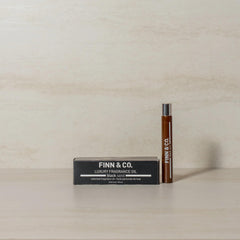 Finn & Co Black Sand rollerball shown for on-the-go scent.