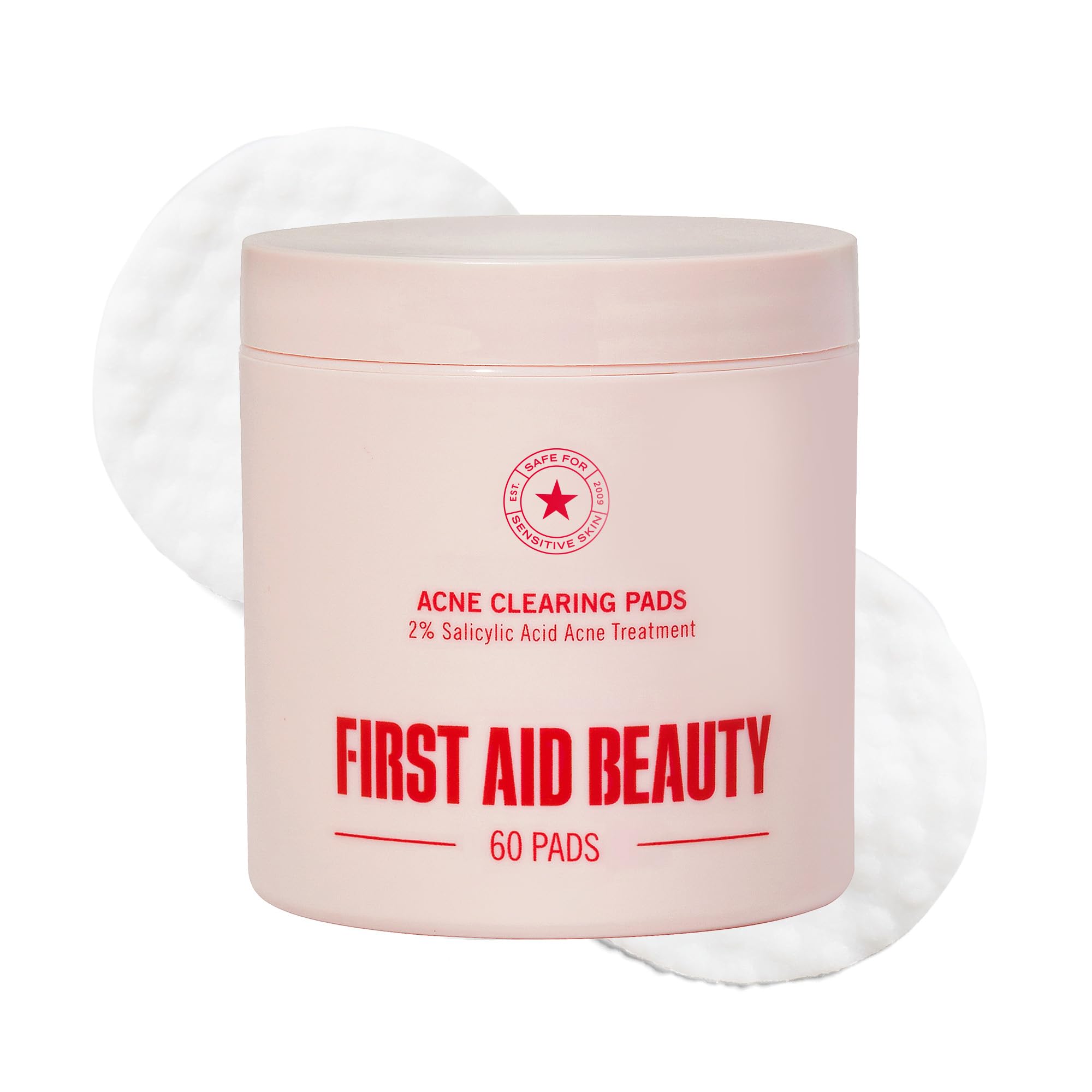 First Aid Beauty Acne Pads face close-up showing dual-sided pads for clear pores.