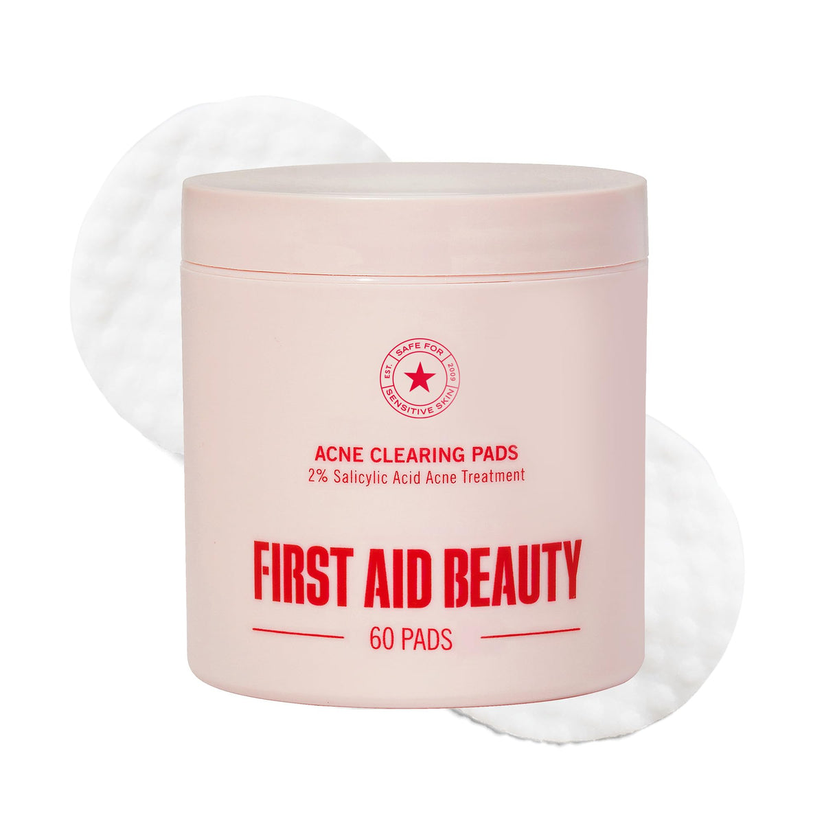 First Aid Beauty Acne Pads face close-up showing dual-sided pads for clear pores.