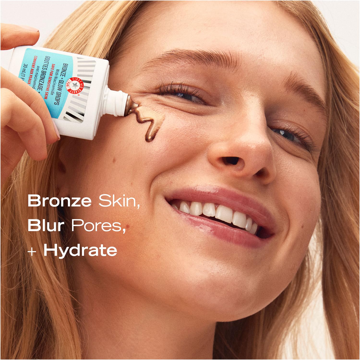 First Aid Beauty Bronze + Glow Drops texture-on-skin demonstrates sheer, blendable bronze tint.