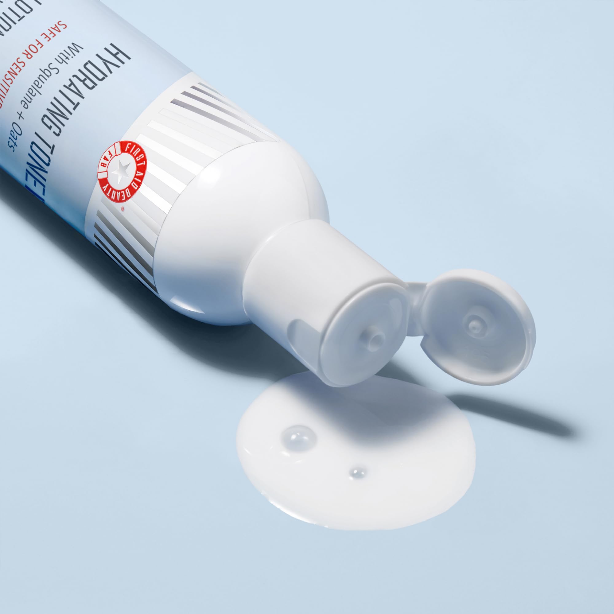 First Aid Beauty hyaluronic acid moisture image implies plumped, hydrated skin.
