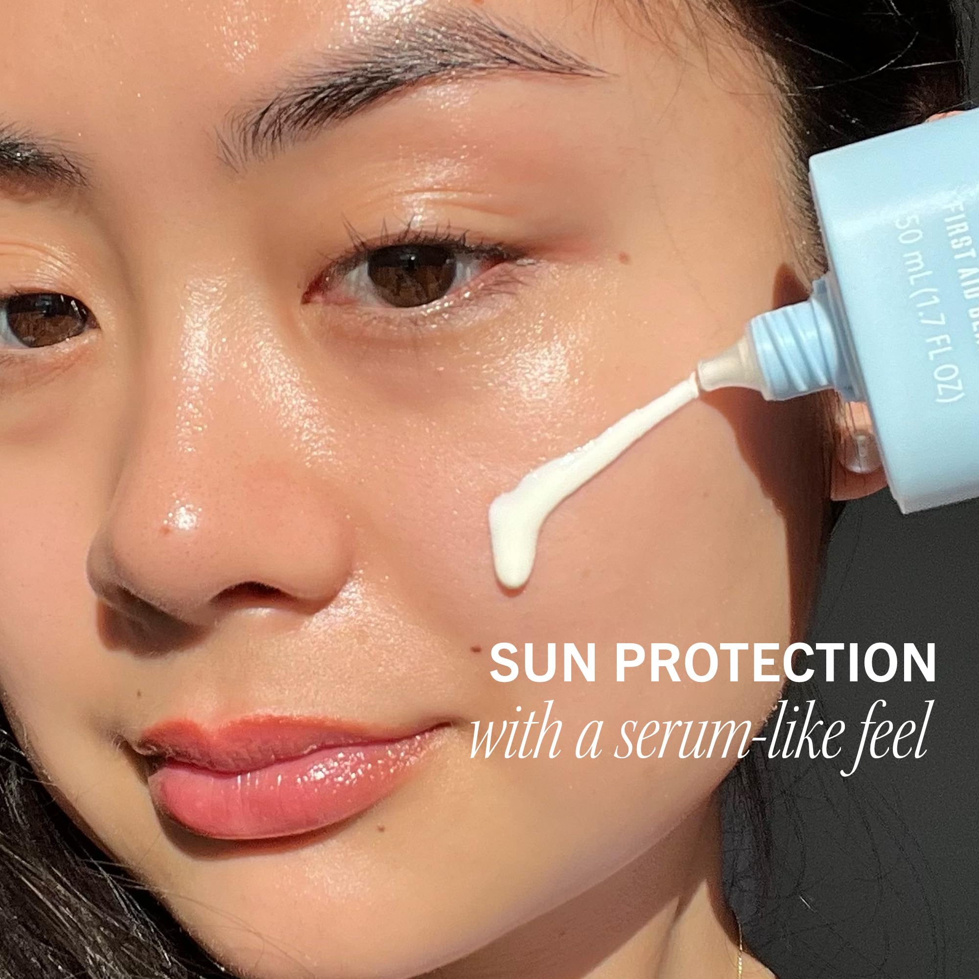 First Aid Beauty Hydrating Sunscreen Milk texture-serum-like swatch on skin.